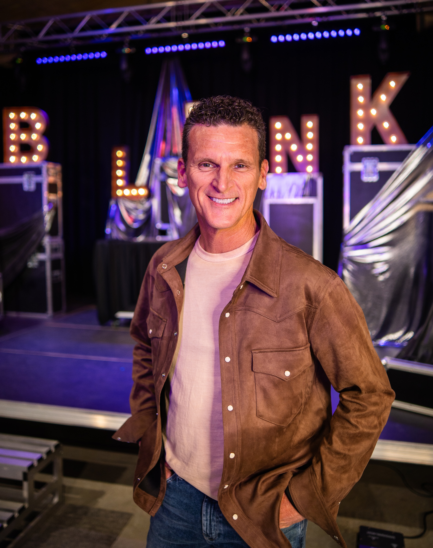Illusionist on stage in dramatic light